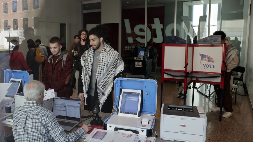 People cast their ballots during early voting in the state's primary on the campus of the University of Michigan in Ann Arbor, Michigan, on Feb. 20, 2024. 